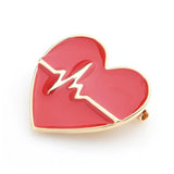 broche coeur rouge ardent couchée