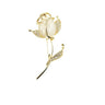 broche rose dorée